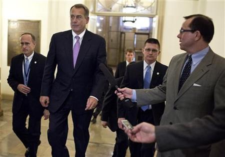 U.S. Speaker of the House of Representatives Boehner walks to his office in the U.S. Capitol after meeting with U.S. President Obama at the White House in Washington